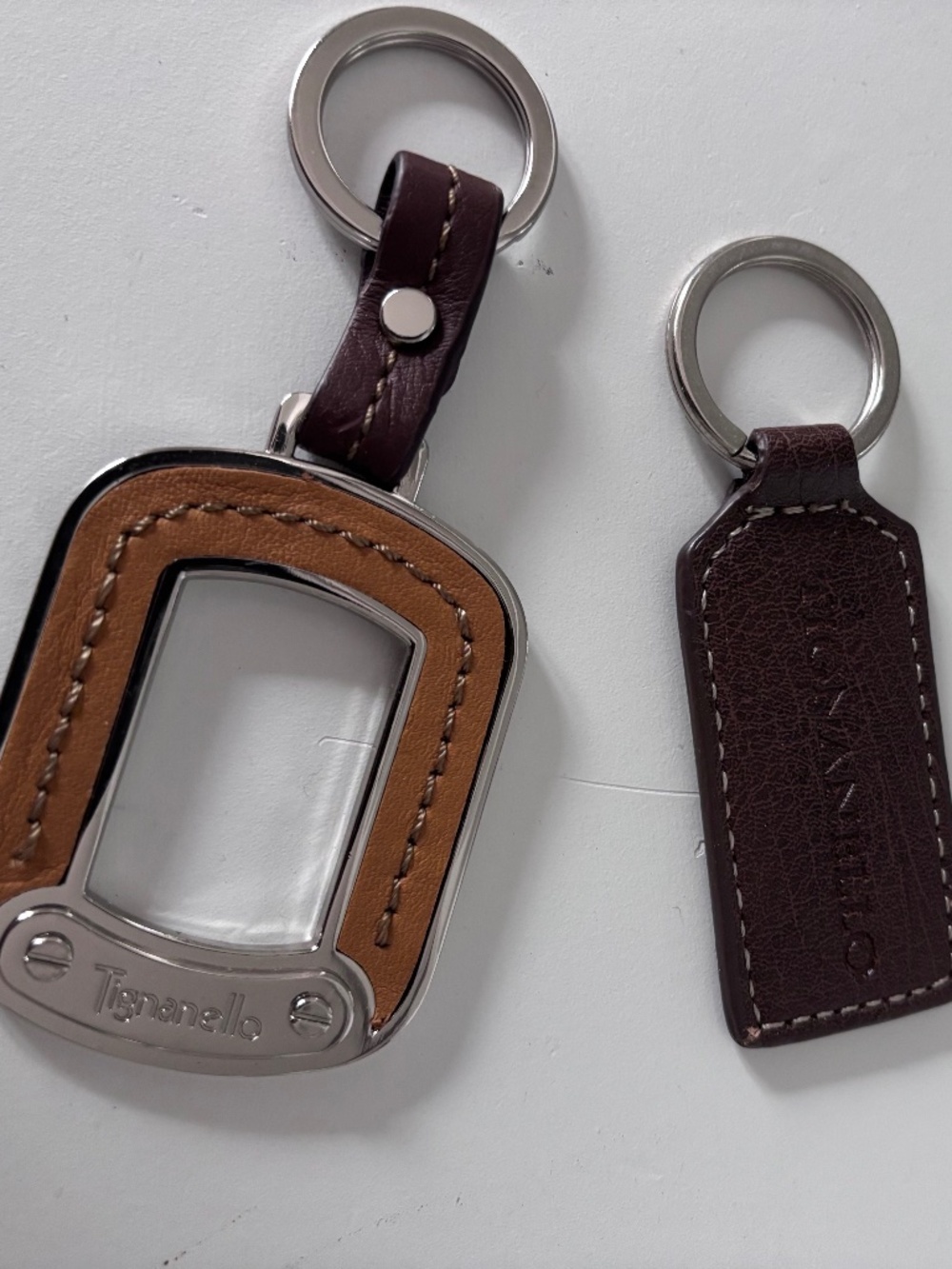 2 leather Tignanello keychains/bag charms